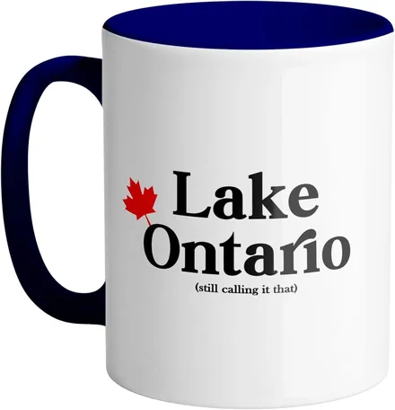 White ceramic mug with a maple leaf and the words Lake Ontario, still calling it that